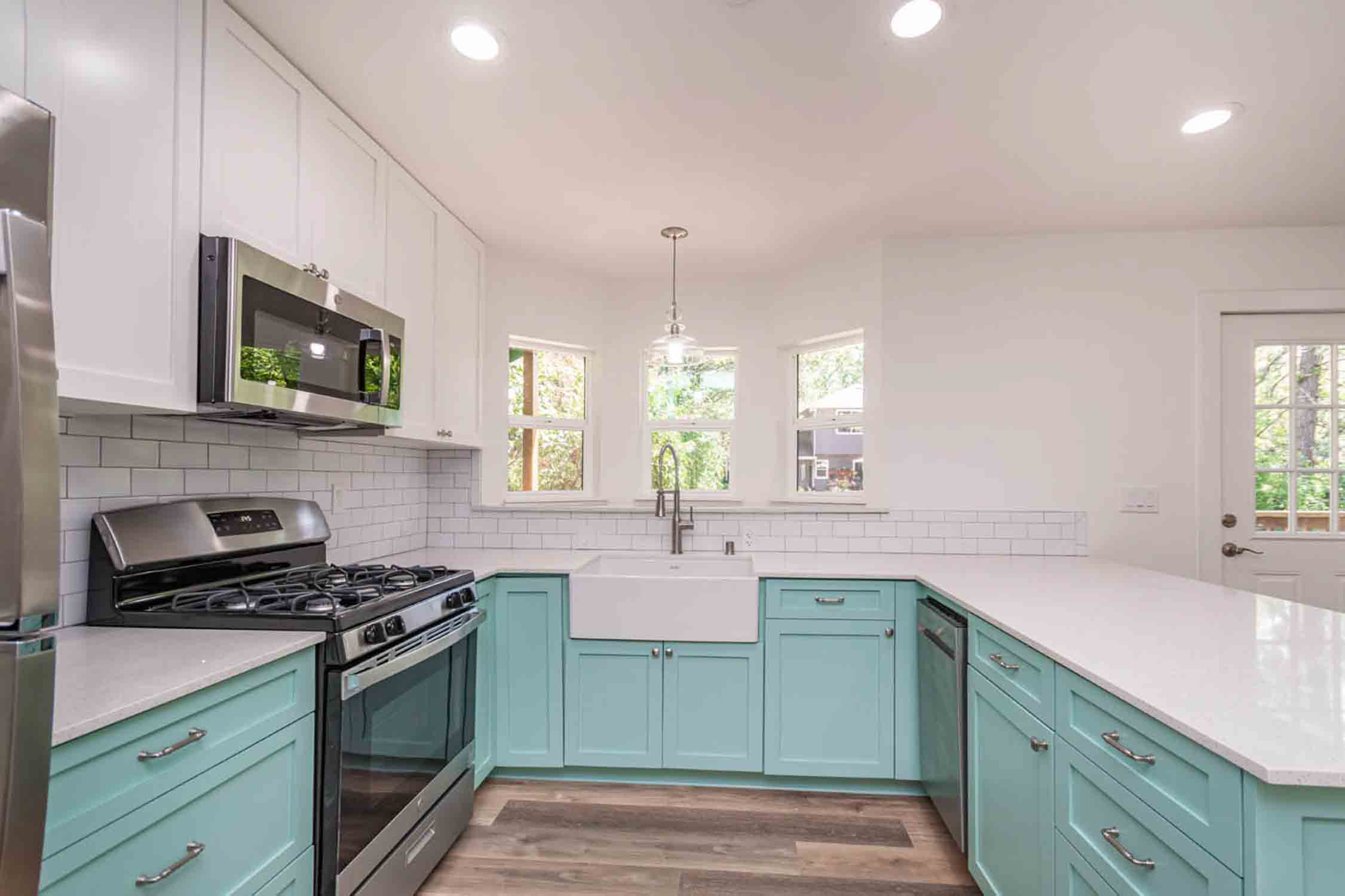 East Bay tiny house companies and their project of a mint green kitchen in a home.