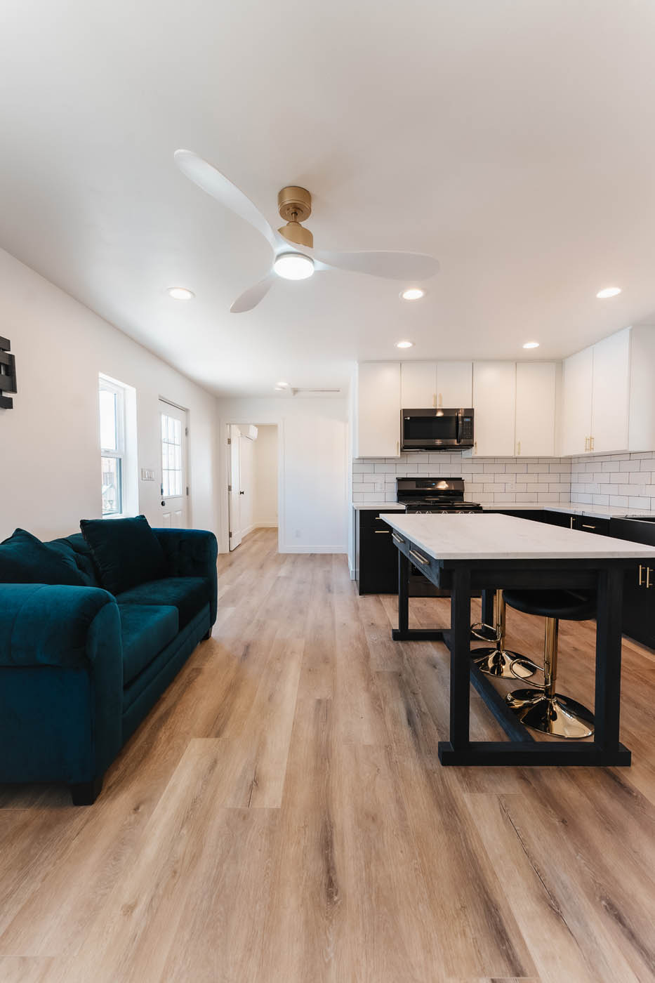 A picture of the kitchen/living room of a tiny ADU mother-in-law unit from Anchored Tiny Homes.