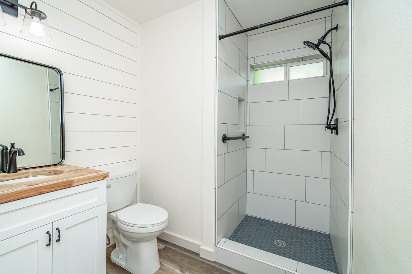 A modern white bathroom in a casita home.