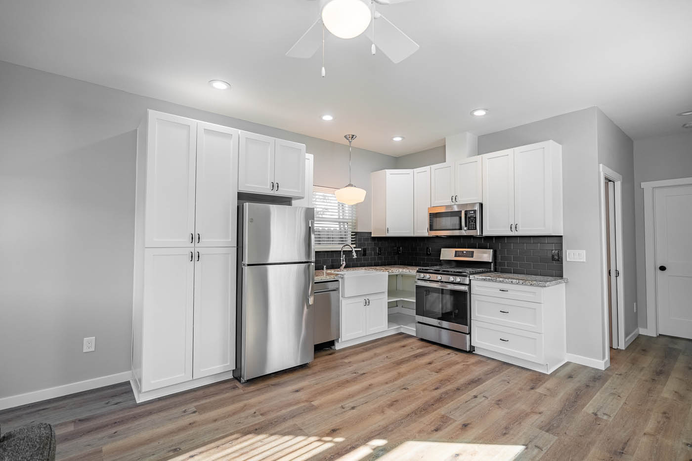 A beautiful white kitchen in an ADU home, contact our Richmond tiny house company today.